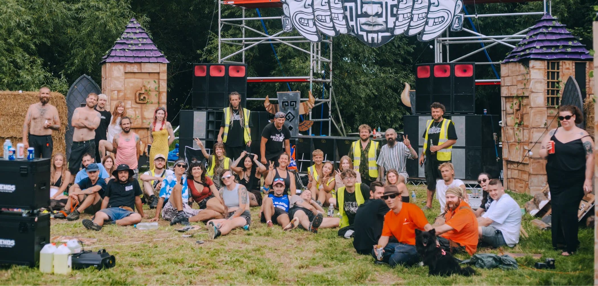 Slipshod Gathering crew and punters in front of the Natures Bosh food stall, daylight.