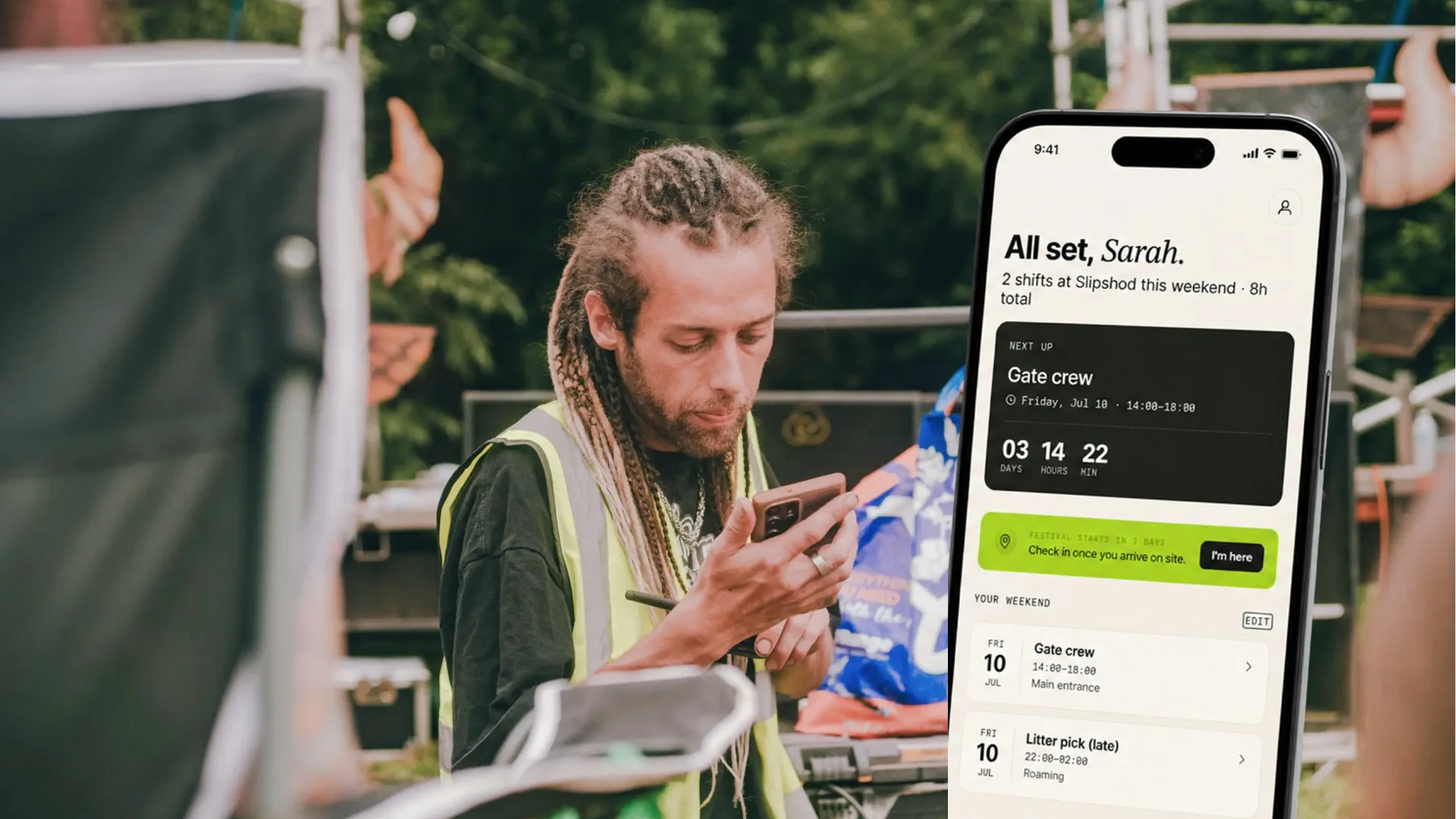 A crew member in hi-vis checks his phone at the festival; the Lanyard app home screen stands beside him