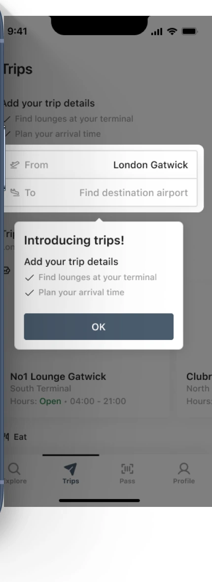 The trips screen behind it, introducing trip details so lounges and arrival times can be planned.